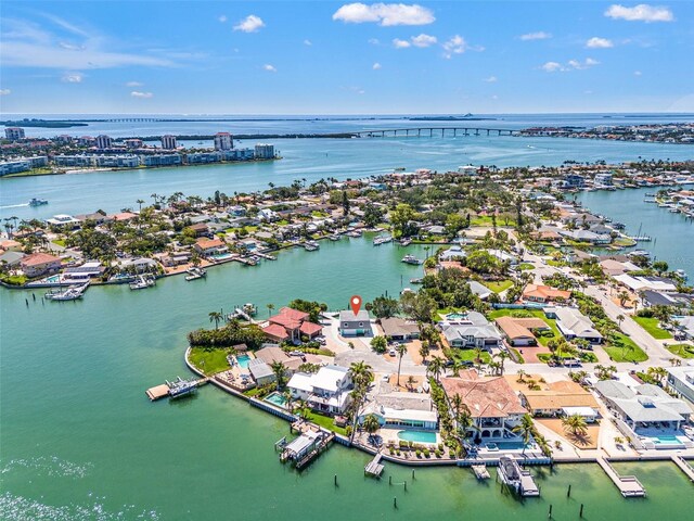 3021 Alton Dr, St Pete Beach, FL 33706 - aerial perspective of suburban area with a large body of water and a notable bridge