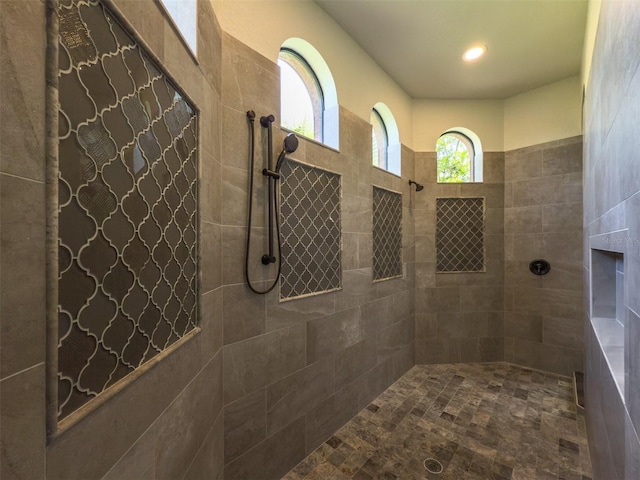 bathroom with tiled shower