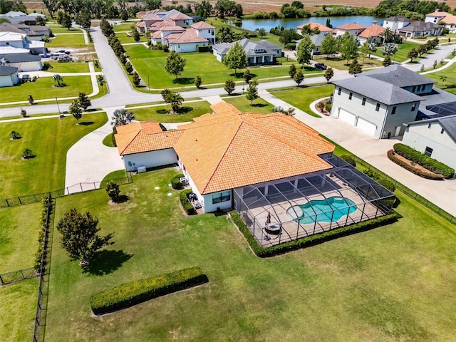 bird's eye view with a residential view and a water view