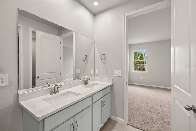 20423 Symphony Pl, Venice, FL 34293 - bathroom with baseboards and double vanity