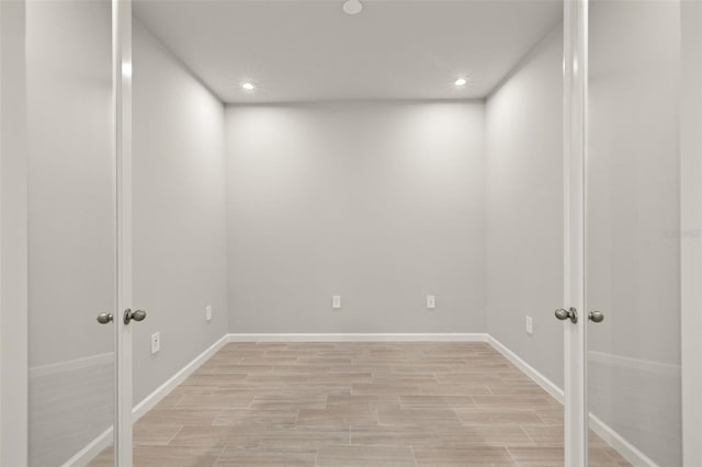 20423 Symphony Pl, Venice, FL 34293 - unfurnished room with french doors, recessed lighting, light wood finished floors, and baseboards