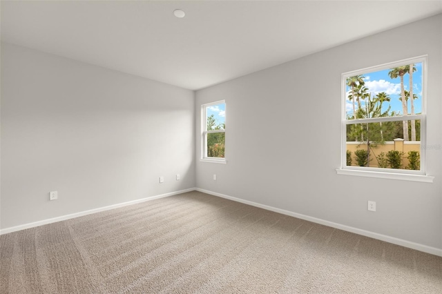 20423 Symphony Pl, Venice, FL 34293 - unfurnished room with baseboards, carpet flooring, and vaulted ceiling