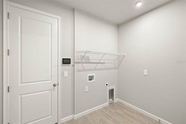 20423 Symphony Pl, Venice, FL 34293 - laundry room featuring hookup for a washing machine, baseboards, light wood-style floors, hookup for an electric dryer, and recessed lighting