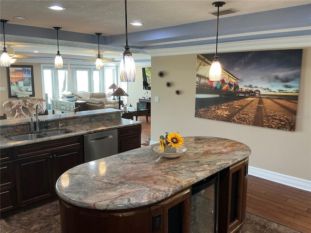 324 6th Ave, Indian Rocks Beach, FL 33785 - kitchen with wine cooler, a kitchen island, baseboards, a sink, and dishwasher