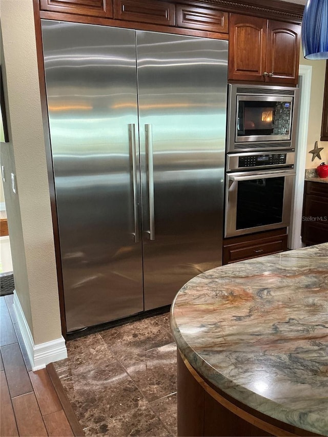 324 6th Ave, Indian Rocks Beach, FL 33785 - kitchen featuring baseboards and built in appliances