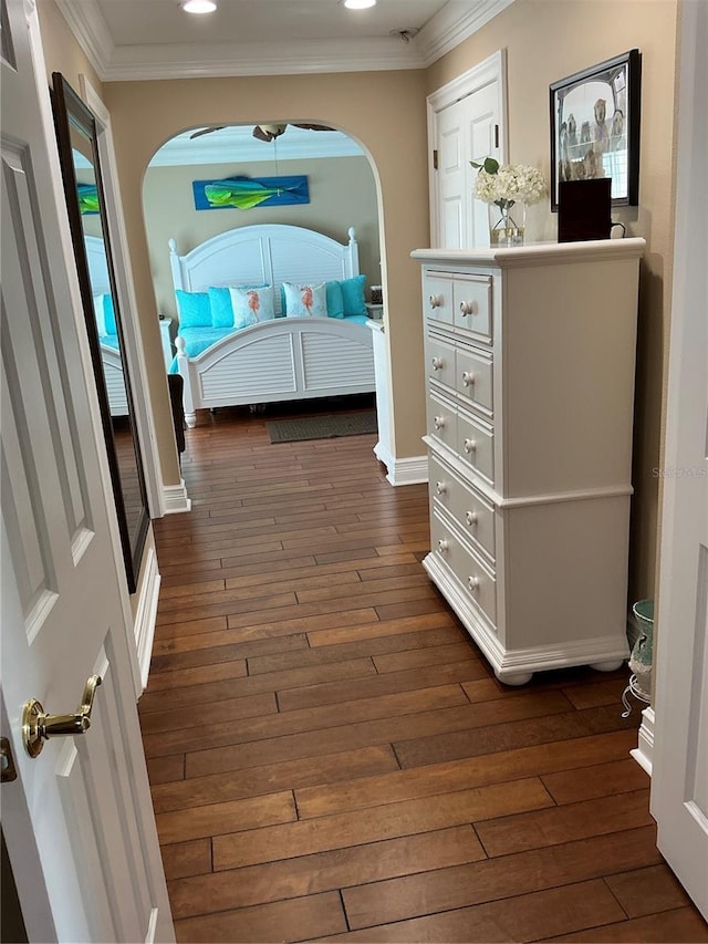 324 6th Ave, Indian Rocks Beach, FL 33785 - bedroom featuring crown molding, arched walkways, dark wood-type flooring, and recessed lighting