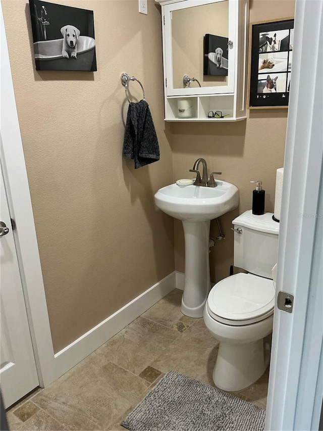 324 6th Ave, Indian Rocks Beach, FL 33785 - half bathroom with toilet and baseboards