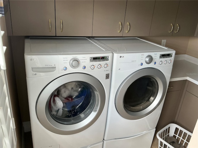 324 6th Ave, Indian Rocks Beach, FL 33785 - washroom featuring cabinet space and washing machine and dryer