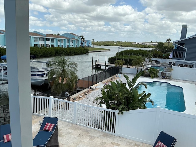 324 6th Ave, Indian Rocks Beach, FL 33785 - view of swimming pool featuring fence, a patio, a boat dock, a fenced in pool, and a water view
