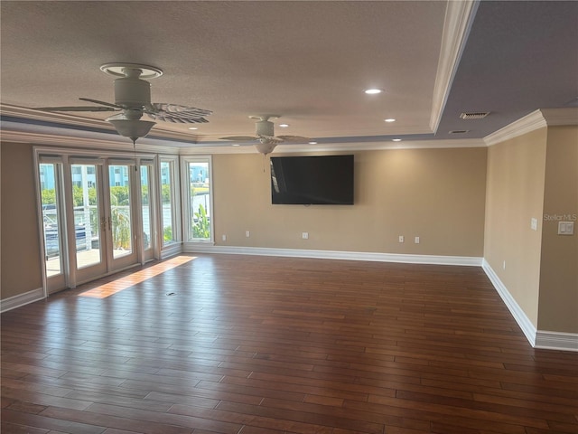 324 6th Ave, Indian Rocks Beach, FL 33785 - spare room featuring a tray ceiling, baseboards, crown molding, and a ceiling fan