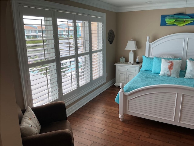 324 6th Ave, Indian Rocks Beach, FL 33785 - bedroom featuring baseboards, ornamental molding, and hardwood / wood-style flooring
