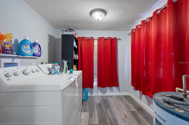 laundry room featuring independent washer and dryer, laundry area, a textured ceiling, baseboards, and dark wood-style floors