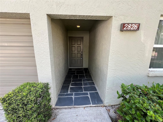 2826 Rampart Cir, Clearwater, FL 33761 - doorway to property with stucco siding