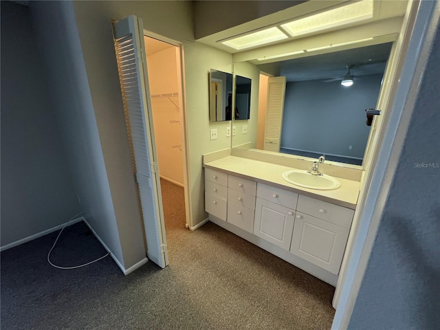 2826 Rampart Cir, Clearwater, FL 33761 - bathroom featuring a ceiling fan, baseboards, vanity, and carpet floors