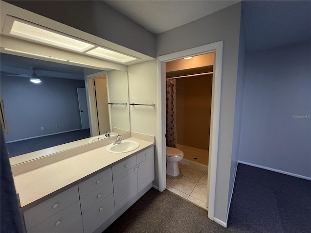2826 Rampart Cir, Clearwater, FL 33761 - full bathroom featuring toilet, a stall shower, baseboards, tile patterned flooring, and vanity