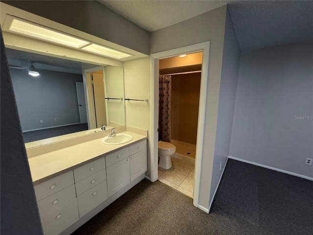 2826 Rampart Cir, Clearwater, FL 33761 - bathroom featuring toilet, a stall shower, tile patterned floors, baseboards, and vanity