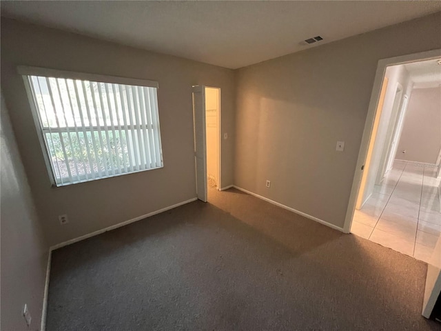 2826 Rampart Cir, Clearwater, FL 33761 - carpeted empty room with baseboards and visible vents