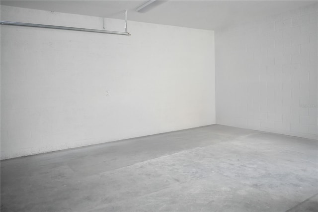 garage with concrete block wall