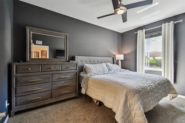1003 Fairwaycove Ln Unit 103, Bradenton, FL 34212 - bedroom with dark colored carpet and a ceiling fan