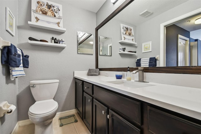1003 Fairwaycove Ln Unit 103, Bradenton, FL 34212 - bathroom featuring toilet, tile patterned floors, vanity, and baseboards