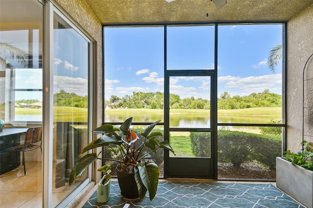 1003 Fairwaycove Ln Unit 103, Bradenton, FL 34212 - sunroom / solarium featuring view of scattered trees, a water view, and plenty of natural light