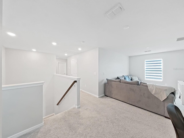 17737 Everlong Dr, Land O Lakes, FL 34638 - living room featuring recessed lighting, baseboards, visible vents, and light carpet