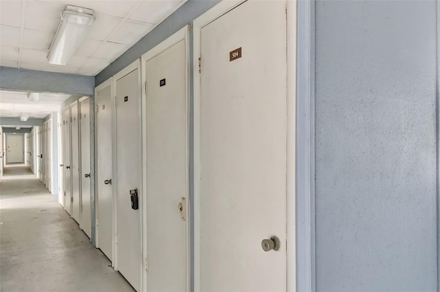 hallway with concrete flooring