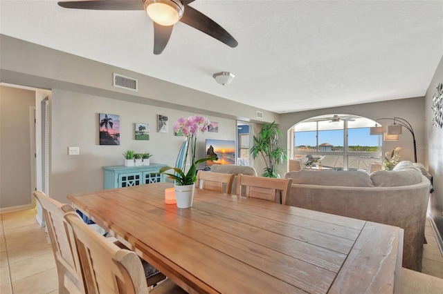 dining space featuring ceiling fan, light tile patterned flooring, and visible vents
