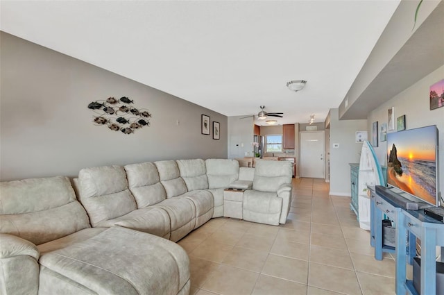 living area with light tile patterned flooring and ceiling fan