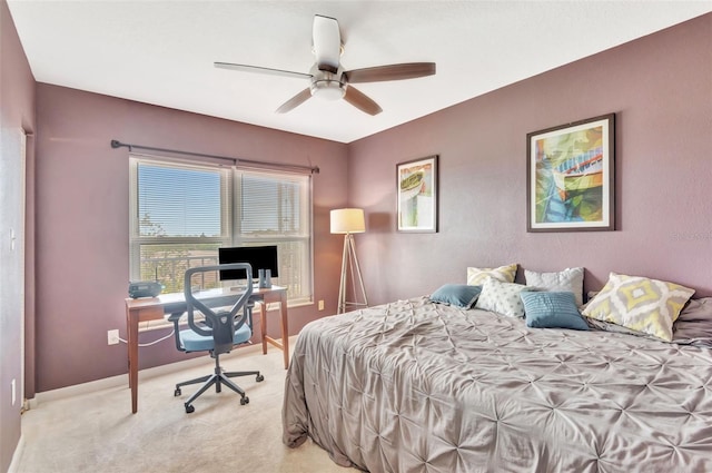 bedroom with baseboards, light colored carpet, and ceiling fan