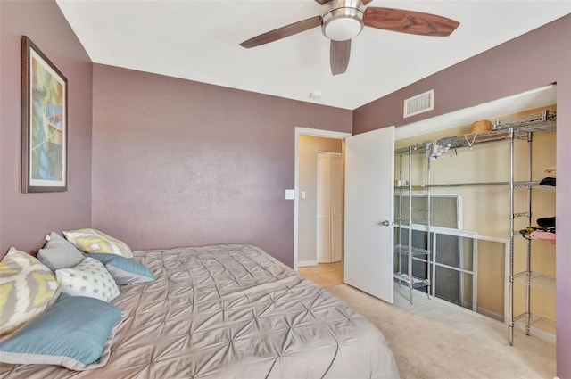 bedroom featuring visible vents, a ceiling fan, and carpet floors