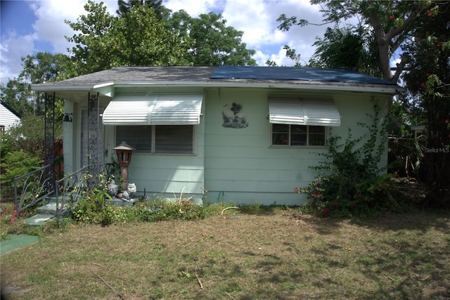 5009 12th Ave S, Gulfport, FL 33707 - view of side of property featuring a lawn