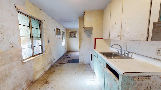 5009 12th Ave S, Gulfport, FL 33707 - kitchen featuring light countertops, dishwasher, a sink, and tasteful backsplash
