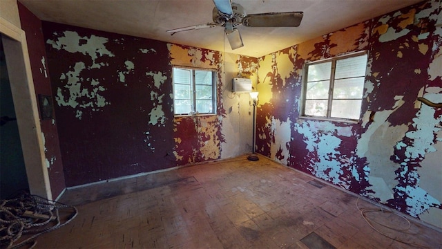 5009 12th Ave S, Gulfport, FL 33707 - empty room featuring a ceiling fan and a wall mounted air conditioner