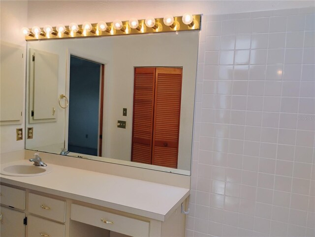 7085 Sunset Dr S Unit A, Saint Petersburg, FL 33707 - bathroom with vanity and a closet