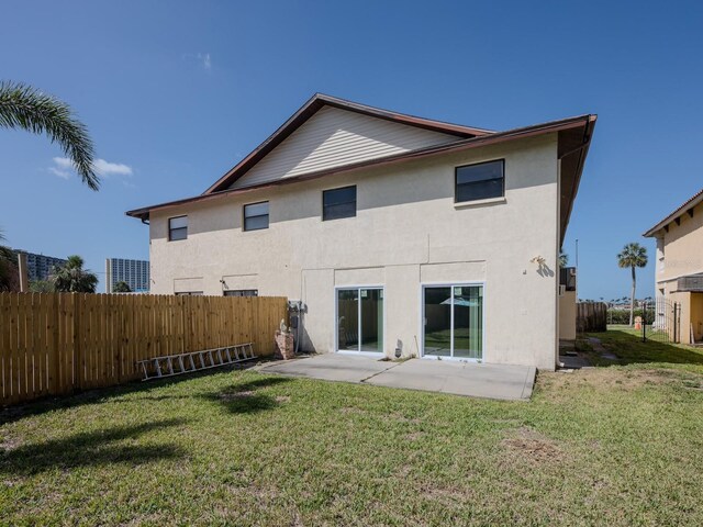 7085 Sunset Dr S Unit A, Saint Petersburg, FL 33707 - rear view of property featuring stucco siding and a patio