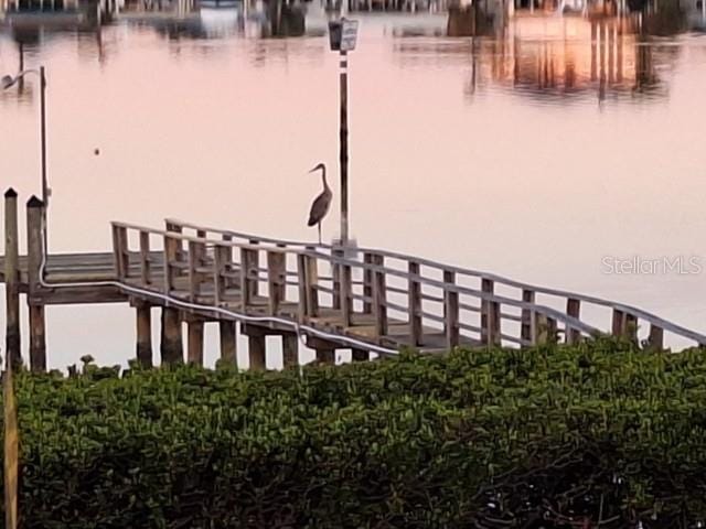 7085 Sunset Dr S Unit A, Saint Petersburg, FL 33707 - dock featuring a water view