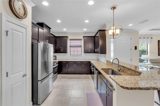 4610 Alexandria Ct, Palmetto, FL 34221 - kitchen featuring crown molding, visible vents, a peninsula, a sink, and appliances with stainless steel finishes