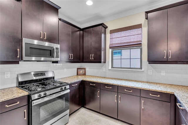 4610 Alexandria Ct, Palmetto, FL 34221 - kitchen featuring crown molding, light stone counters, backsplash, and stainless steel appliances