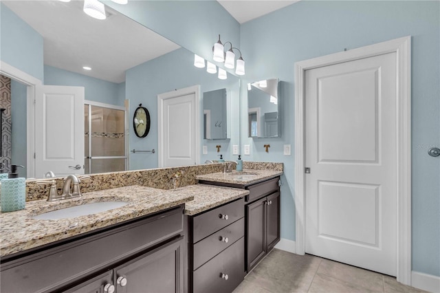 4610 Alexandria Ct, Palmetto, FL 34221 - full bath with a sink, baseboards, tile patterned flooring, and double vanity