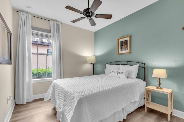 4610 Alexandria Ct, Palmetto, FL 34221 - bedroom featuring baseboards, ceiling fan, and wood finished floors