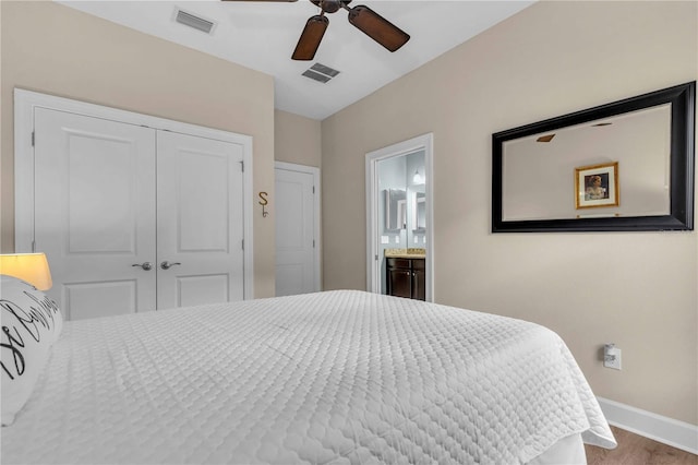 4610 Alexandria Ct, Palmetto, FL 34221 - bedroom featuring baseboards, a closet, wood finished floors, and visible vents