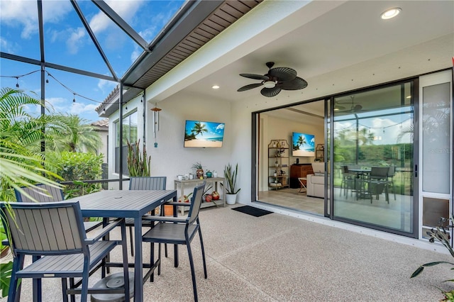 4610 Alexandria Ct, Palmetto, FL 34221 - view of patio with ceiling fan, glass enclosure, and outdoor dining space