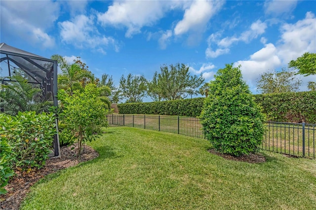 4610 Alexandria Ct, Palmetto, FL 34221 - view of yard featuring a fenced backyard and glass enclosure