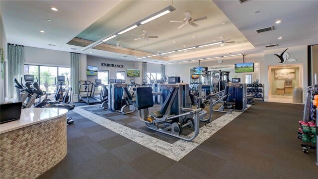 4610 Alexandria Ct, Palmetto, FL 34221 - workout area with visible vents, carpet flooring, ceiling fan, and a tray ceiling