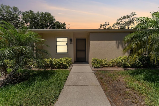 view of front of house featuring stucco siding