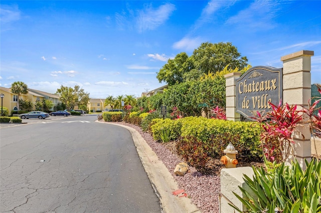 view of street with a residential view and curbs