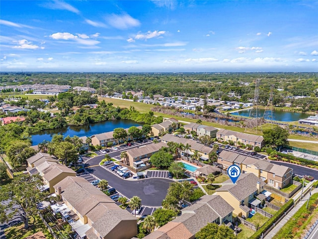 birds eye view of property with a water view and a residential view