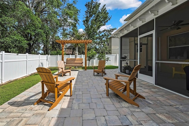 view of patio / terrace with a sunroom, a fenced backyard, and a pergola