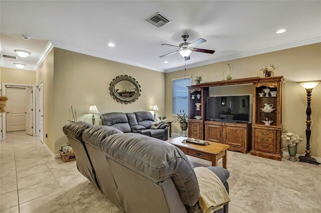 living area with ceiling fan, visible vents, crown molding, light tile patterned floors, and baseboards